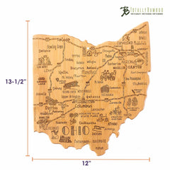 A laser-engraved bamboo cutting board shaped like Ohio, showcasing detailed depictions of cities, landmarks, and roads. The state cutting board measures 12 inches vertically and 13-1/2 inches horizontally. It includes a small loop at the top for hanging and features "Totally Bamboo" etched on its surface.