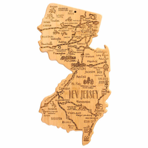 The Totally Bamboo Destination New Jersey Cutting Board, measuring 8-5/8" x 16-5/8", is crafted from bamboo and shaped like the state of New Jersey. It features a laser-engraved design with hand-drawn city names and landmark illustrations, offering a detailed artistic map of the state.