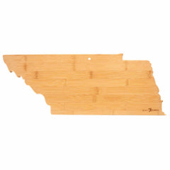 The Totally Bamboo Destination Tennessee Cutting Board, measuring 18-1/2" x 7", is crafted from bamboo and shaped like the state of Tennessee. It features a smooth cutting surface, a small hole at the top for easy hanging, and intricate laser-engraved artwork that showcases local landmarks.