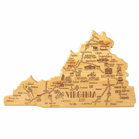 The Destination Virginia Cutting Board from Totally Bamboo, measuring 16-1/2" x 9-1/2", is crafted from bamboo and designed in the shape of Virginia. It includes laser engravings of cities and landmarks like Richmond, Norfolk, and Shenandoah National Park, as well as illustrations of local wildlife and attractions etched into its surface.