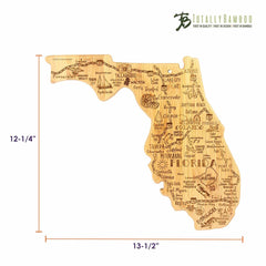 This expertly crafted Destination Florida Cutting Board by Totally Bamboo is designed in the shape of Florida and features laser-engraved artwork including city names, landmarks, and intricate details. It measures 13-1/2 inches wide by 12-1/4 inches tall.