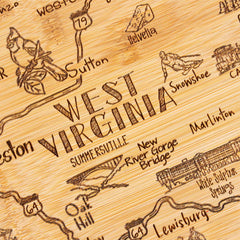 The Destination West Virginia Cutting Board by Totally Bamboo is a laser-engraved wooden map that highlights locations such as Summersville and New River Gorge Bridge. It features detailed depictions of local wildlife, attractions, roads, and landmarks, making it both a visual delight and a uniquely shaped cutting board for the state. The dimensions are 13-1/2" x 11-3/4".