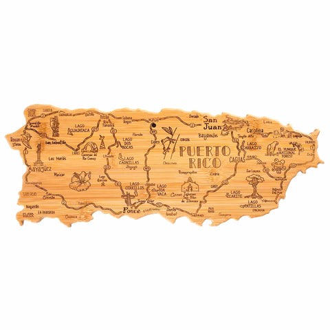 This decorative charcuterie board from Totally Bamboo's Destination Series serves as a wooden map of Puerto Rico, showcasing hand-drawn details such as labeled cities, roads, and landmarks. The Destination Puerto Rico Cutting Board measures 18" x 7" and beautifully highlights the island's regions while functioning as a unique bamboo cutting surface.