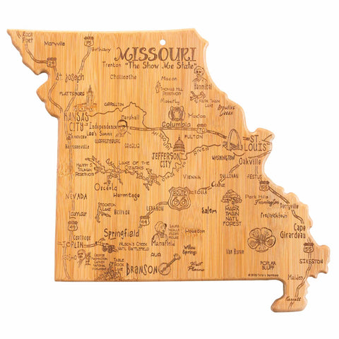 Introducing the Destination Missouri Cutting Board by Totally Bamboo, measuring 11-3/4" x 13-1/2". This bamboo board is expertly shaped like the state of Missouri and features laser-engraved artwork depicting cities such as Kansas City and St. Louis. It elegantly highlights icons representing local attractions, landmarks, and symbols that honor the state's vibrant culture.