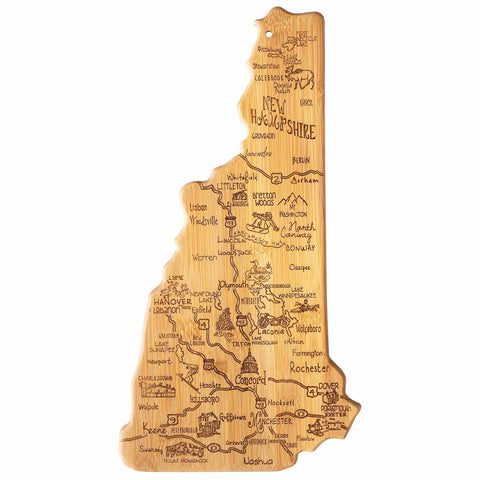 The Totally Bamboo "Destination New Hampshire" Cutting Board, measuring 9" x 17", is a bamboo cutting surface designed in the shape of New Hampshire. It features laser-engraved artwork highlighting city names such as Concord, Manchester, and Nashua, along with iconic landmarks and attractions across the map.