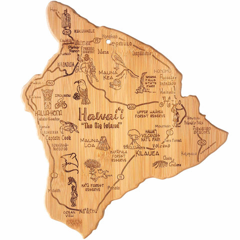 The Totally Bamboo Destination Hawaii Cutting Board, measuring 13-1/4" x 11-1/2", is an illustrated wooden map of Hawaii's Big Island that also serves as a state-shaped cutting board. It showcases hand-drawn landmarks, wildlife, and place names such as Mauna Kea and Kilauea. For added charm, decorative palm trees and turtles are laser-engraved onto the bamboo cutting surface.