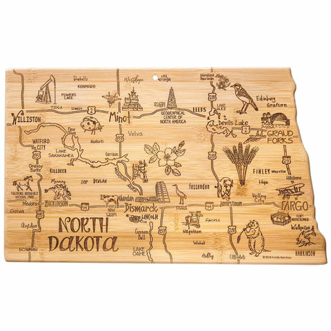 The Destination North Dakota Cutting Board by Totally Bamboo, measuring 9-3/4" x 16", is expertly crafted in the shape of North Dakota. It boasts intricate engravings featuring city names, landmarks, and native wildlife such as bison and oil wells. Major roads and rivers are also incorporated into this one-of-a-kind piece.