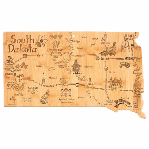 The Totally Bamboo Destination South Dakota Cutting Board, measuring 9-3/4" x 16", is expertly crafted from bamboo and showcases a detailed map of South Dakota. It includes engravings of landmarks like Mount Rushmore and Badlands National Park, as well as cities such as Sioux Falls, complemented by decorative icons of a bison and pheasant.