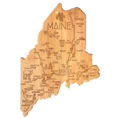 Presenting the Totally Bamboo Destination Maine Cutting Board, measuring 15" x 10-1/2": a captivating bamboo cutting board designed in the shape of Maine. It features detailed laser-engraved artwork that includes city names and illustrations of landmarks and attractions like Portland, Bangor, Augusta, and Baxter State Park.