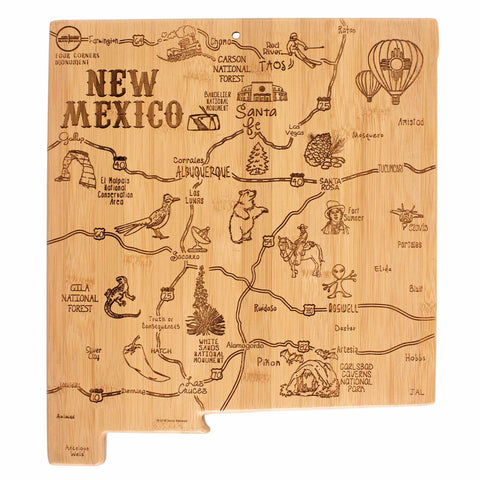 The Totally Bamboo Destination New Mexico Cutting Board, measuring 11-3/4" x 13-1/2", is uniquely crafted from bamboo in the shape of New Mexico. This board features laser-engraved artwork highlighting city names, landmarks, and symbols like cacti, hot air balloons, and animals. Major cities such as Albuquerque and Santa Fe are distinctly marked on this one-of-a-kind piece.