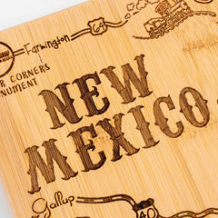 The Destination New Mexico Cutting Board by Totally Bamboo serves as both a functional kitchen tool and an artistic wooden map of the state, intricately laser-engraved with roads and landmarks such as Farmington, Gallup, and the Four Corners Monument. This 11-3/4" x 13-1/2" piece captures New Mexico's charm with detailed illustrations like that of a train.