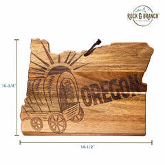 Made from acacia wood, the Rock & Branch® Origins Series Oregon Cutting Board by Totally Bamboo highlights the outline of Oregon with a laser-engraved covered wagon and the word "OREGON." Measuring 10-3/4 inches tall and 14-1/2 inches wide, it also features the Rock & Branch logo at the top.