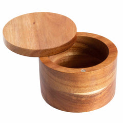 The Rock & Branch® Salt Cellar from Totally Bamboo is crafted in a round shape using Acacia wood, boasting a smooth, natural finish. Its slightly raised lid unveils the hollow interior of this 6-oz. capacity container. The simple and elegant design accentuates the wood's grain and variations, and it includes a discreet magnetic lock for secure closure.