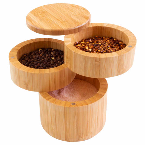 The Triple Salt Cellar with Swivel Lids by Totally Bamboo offers a stylish and functional addition to your kitchen, featuring magnetic swivel lids that reveal a trio of flavors: black peppercorns, red chili flakes, and pink Himalayan salt.