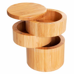 Introducing the Triple Salt Cellar with Swivel Lids by Totally Bamboo. This elegant bamboo container features three cylindrical segments that swivel open to reveal compartments capable of holding small items. Made from light bamboo wood, it highlights the natural grain and offers a glimpse of the sections below with its slightly open top lid. Each segment can hold up to 1-1/3 cups, combining functionality with stylish design.