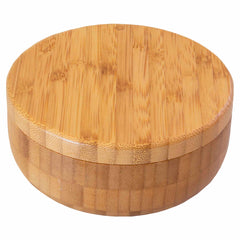 Introducing the Salt Keeper Duet Salt Cellar by Totally Bamboo, a 1-cup capacity round bamboo container with a magnetic lock. It features a snug-fitting lid that highlights the smooth, natural wood finish and unique grain patterns typical of bamboo.