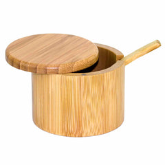 The Little Dipper Salt Cellar by Totally Bamboo, with a 6-oz. capacity, showcases a swiveling lid and comes complete with a small bamboo spoon inside. This round bamboo container features a smooth, natural wood finish and is ideal for securely storing small kitchen items.