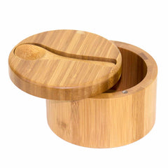 The Big Dipper Salt Cellar by Totally Bamboo, designed with a 10-oz. capacity, showcases a round bamboo design with a perfectly matching lid that is partially open to reveal its interior. The lid features a carved groove, where the included small wooden salt spoon fits neatly, while a magnetic lock keeps the lid securely closed, enhancing the appeal of its natural finish.