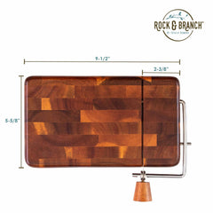 This stylish rectangular cheese slicer from Totally Bamboo features a wire cutting mechanism and a wooden handle, making it an ideal match for your Rock & Branch® Acacia Charcuterie Board. It measures 9-1/2" in length, 5-5/8" in height, and 2-3/8" in width, with the "Rock & Branch by Twine Living" logo at the top.