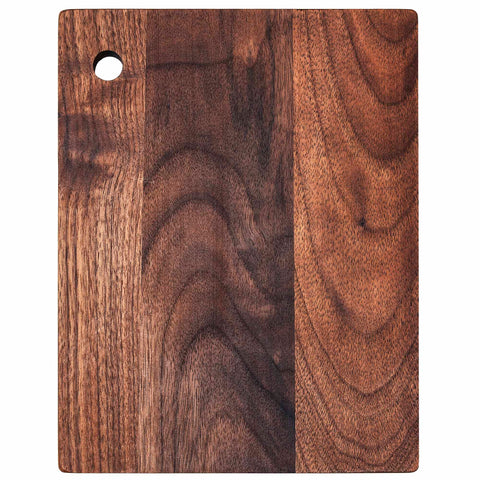 The TB Home® Walnut Wood Small Cutting Board by Totally Bamboo features a rustic elegance, with its smooth surface showcasing the natural grain pattern and varying shades of brown, complemented by a convenient hole in the upper left corner. Dimensions: 8" x 6-3/8".