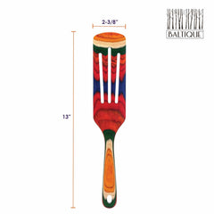 The sentence can be rewritten as: 

A vibrant wooden slotted spatula crafted from colored birch and showcasing a stunning rainbow pattern, the Baltique® Marrakesh Collection Spurtle by Totally Bamboo measures 13 inches long and 2-3/8 inches wide. It is presented on a white background with the Baltique logo in the top right corner.