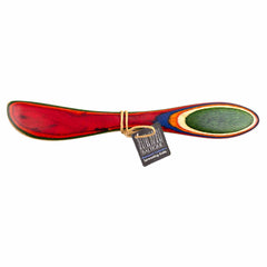 The Totally Bamboo Baltique® Marrakesh Collection Spreader Knife, 8", showcases a striking red and green gradient, evoking the lively ambiance of colorful marketplaces. Attached is a small tag reading "Dantique Spreading Knife.