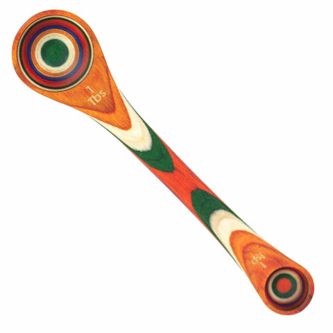 The vibrant 2-in-1 Measuring Spoon from the Baltique® Marrakesh Collection by Totally Bamboo features concentric circles in red, blue, green, and gold on its smooth, elongated wooden design.