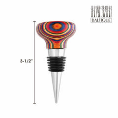 This Baltique® Marrakesh Collection Bottle Stopper by Totally Bamboo showcases a lively rainbow wood grain pattern inspired by the colorful markets of Morocco. Standing at 3-1/2 inches tall, it features a silver metal base and black rubber seal for a tight fit. The top right corner is adorned with the "Baltique" logo.