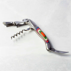 The Baltique® Marrakesh Collection Waiter's Friend Corkscrew by Totally Bamboo features a spiral screw, bottle opener, and serrated knife on a sturdy stainless steel frame, enhanced with a vibrant handle in green, orange, and purple shades, beautifully showcased against a simple white background.