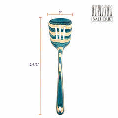 This slotted spatula, part of the Baltique® Mykonos Collection by Totally Bamboo, boasts a striking blue and natural wood layered pattern crafted from colored birch. It measures 12-1/2 inches in length and 3 inches in width, with the brand name and a tree logo elegantly displayed in the upper right corner.