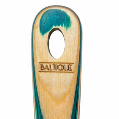 This versatile kitchen tool from the Baltique® Mykonos Collection by Totally Bamboo is a 13-inch Spurtle featuring a close-up of a wooden utensil with a vibrant blue-green stain. The word "Baltique" is elegantly engraved below its top hole, accentuating the beautiful natural wood grain and colored birch finish.