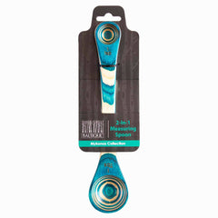 This vibrant 2-in-1 measuring spoon, part of the Baltique® Mykonos Collection by Totally Bamboo, is crafted from colored birch with a distinctive blue and teal design featuring concentric circles. The packaging showcases the brand logo "Baltique" and clearly indicates measurements for 1 tbsp and 1 tsp.