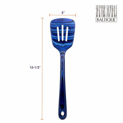 This slotted spatula from the Totally Bamboo's Baltique® Malta Collection showcases an eye-catching design with wavy blue and black lines, crafted from colored birch. Measuring 12-1/2 inches in length and 3 inches in width, it prominently displays the Baltique logo in the top-right corner.