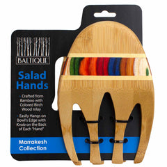 The Totally Bamboo Baltique® Marrakesh Collection Salad Serving Set, measuring 11-3/4 inches, includes bamboo salad hands adorned with vibrant birch wood inlays. Designed for convenience, they come with knobs on the back to rest on bowl edges and are elegantly packaged with a label reading "Baltique Salad Hands.