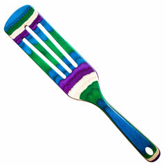 As part of the Totally Bamboo Baltique® Mumbai Collection, this 13" spurtle showcases a vibrant design with a flat, slotted head and an abstract-striped handle in shades of blue, green, purple, and white—engineered to be safe for non-stick surfaces.