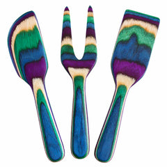 Introducing the Baltique® Mumbai Collection 3-Piece Cheese Tool Set from Totally Bamboo: a vibrant selection of kitchen tools crafted from Colored Birch. This eye-catching ensemble, featuring a spatula, fork, and paddle with a striking striped pattern in blue, green, purple, and cream, will elevate your culinary experience.