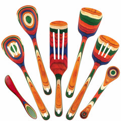 The lively Baltique® Marrakesh Collection 7-Piece Cooking Utensil Set from Totally Bamboo showcases a colorful arrangement of spatulas, spoons, and a spreader crafted from colored birch. These utensils, featuring vibrant striped patterns in shades of orange, red, green, blue, and yellow, are elegantly displayed in a circular design against a white background.