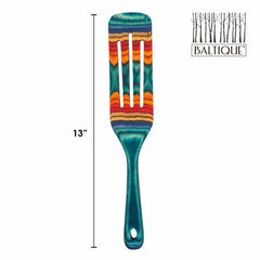 This vibrant kitchen tool, part of the Baltique® Montego Bay Collection by Totally Bamboo, features a colorful striped spurtle with a slotted design. Measuring 13 inches, its teal handle is beautifully layered with multicolored stripes of red, orange, yellow, and green. The Baltique logo is elegantly placed in the top right corner.