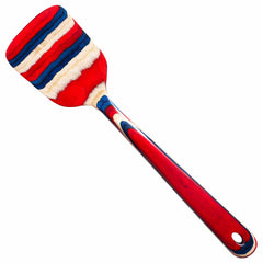 A Baltique® Old Glory Collection Spatula by Totally Bamboo, measuring 12-1/2" and showcasing a painted wooden handle and head decorated with red, blue, and cream stripes inspired by stars and stripes, is displayed against a white background.