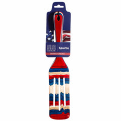 The Baltique® Old Glory Collection Spurtle by Totally Bamboo is a versatile kitchen tool featuring a wavy design in red, white, and blue, reminiscent of the American flag. It includes a handle with a small hole for easy hanging.