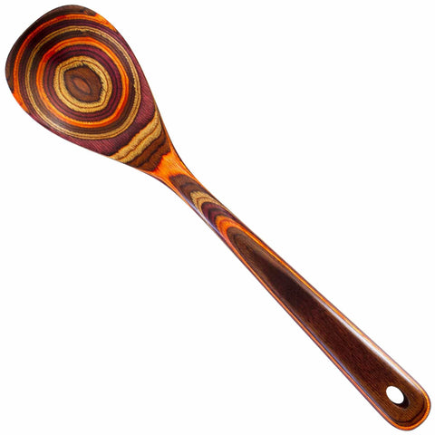 The Totally Bamboo Baltique® Poconos Collection Cooking Spoon, measuring 12-1/2 inches, showcases a marbled pattern of concentric circles in autumnal hues of brown and orange. Its handle has a smooth finish and a hole at the end, ensuring it is safe for use with non-stick cookware for all your culinary creations.