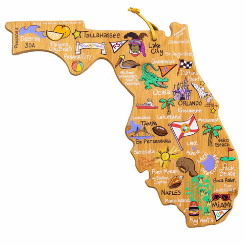 The Florida Cutting Board with Artwork by Fish Kiss™ from Totally Bamboo is a state-shaped cutting board featuring vibrant illustrations of local attractions like Miami, Orlando, and Tampa. Made from bamboo, it showcases images of beaches, palm trees, oranges, a space shuttle, dolphins, and theme parks.