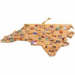 The North Carolina Cutting Board with Artwork by Fish Kiss™, brought to you by Totally Bamboo, is designed in the shape of the state and showcases vibrant illustrations of regional foods, landmarks, and cities such as Raleigh and Charlotte. Equipped with a convenient hanging loop at the top, this board seamlessly combines artistic beauty with kitchen functionality.