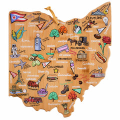 The Ohio Cutting Board with Artwork by Fish Kiss™ from Totally Bamboo serves as a dual-purpose piece, functioning both as a state-shaped cutting board and a wooden map of Ohio. It showcases intricately hand-drawn landmarks and bustling cities such as Columbus, Cleveland, and Cincinnati. The board is adorned with illustrations of local icons like the Buckeye and regional foods including pierogi, all expertly crafted on a premium bamboo surface.