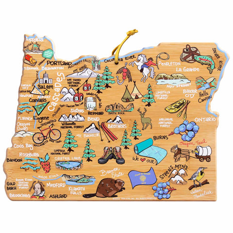 This charming cutting board, the Oregon Cutting Board with Artwork by Fish Kiss™ from Totally Bamboo, showcases delightful illustrations reminiscent of Fish Kiss Artwork. The vibrant design highlights Oregon's cities and landmarks with icons of trees, mountains, and rivers. Major cities like Portland, Salem, and Eugene are clearly labeled alongside other points of interest.