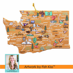 This whimsical Washington Cutting Board with Artwork by Fish Kiss™ from Totally Bamboo features a delightful illustrated map of Washington state, highlighting cities, landmarks, and regional icons such as apples and mountains. The design includes a photo labeled "Fish Kiss™ Artwork by Anne Klein, Owner and Designer," making it an ideal match for any state-shaped cutting boards or bamboo cutting surfaces.