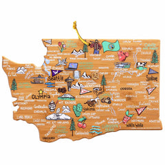 The Washington Cutting Board with Artwork by Fish Kiss™, crafted by Totally Bamboo, is a lively wooden map of Washington State in the shape of the state itself. It features playful cartoon icons such as apples, a ferry, and Mount Rainier. Cities like Seattle, Spokane, and Olympia are whimsically depicted, making it perfect for display or use as a distinctive bamboo cutting surface.