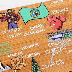 Discover the Washington Cutting Board by Totally Bamboo, featuring Fish Kiss™ Artwork. This unique map design showcases locations like Winthrop, Omak, and Electric City, complete with playful elements such as a lumberjack, apples, and a pretzel against a bamboo cutting surface backdrop.