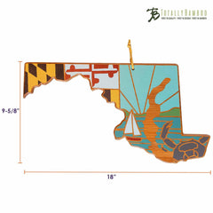 This Maryland Cutting Board by Totally Bamboo, crafted from a luxurious bamboo cutting surface, features vibrant artwork by Summer Stokes showcasing a crab, sailboat, Maryland flag, and waves. Measuring 18 inches by 9-5/8 inches, it prominently displays the Totally Bamboo logo in the top right corner.