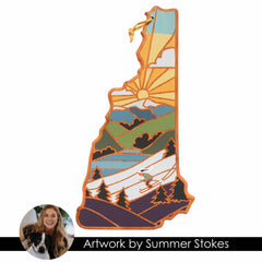 A vibrant depiction of a mountainous landscape with a sunset and skier adorns the New Hampshire-shaped cutting board, enhanced by a circular photo of Summer Stokes and her dog. Ideal for anyone who values distinctive state-themed cutting boards, this piece, crafted by Totally Bamboo, showcases "Summer Stokes Artwork.